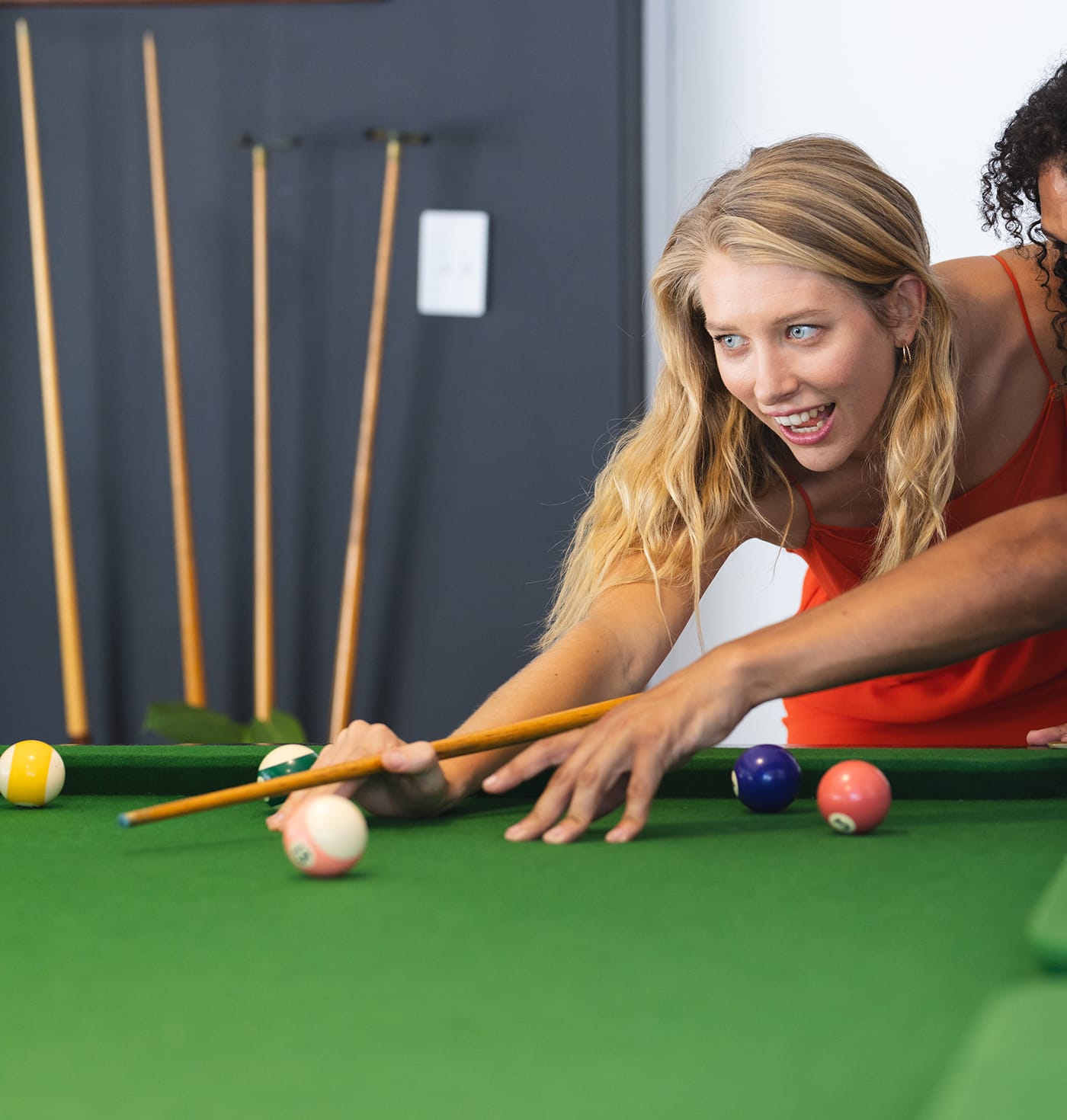 People playing billiards in our billiard room in Coín, Málaga.